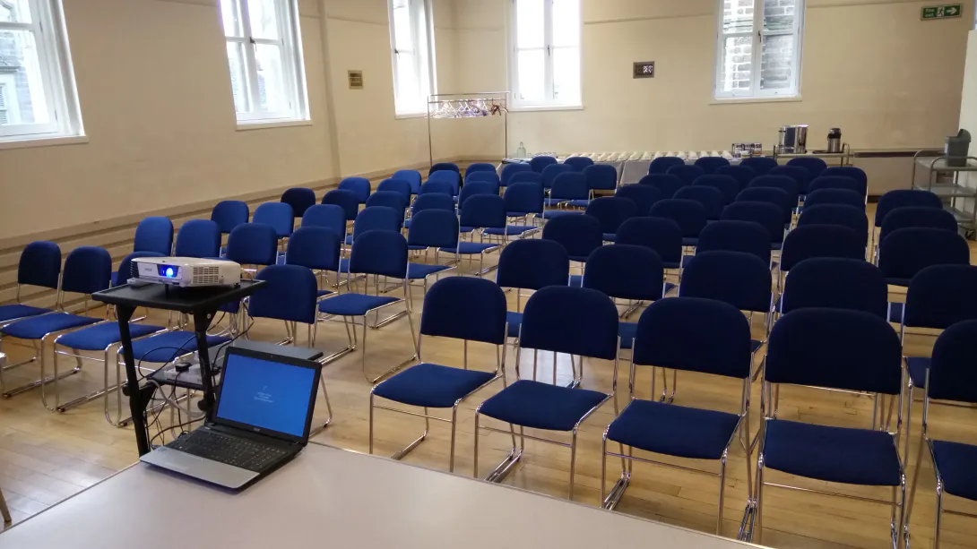 Hall with chairs, speaker's view.